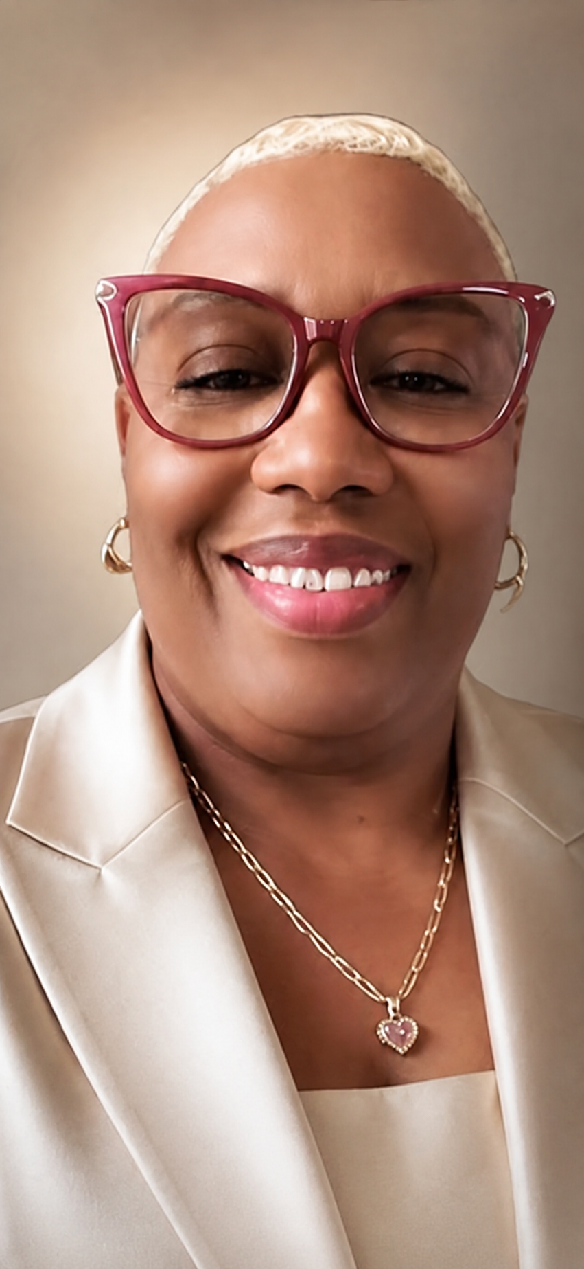 Melinda Jones-Fearance, owner and notary public, smiling in a cream blazer